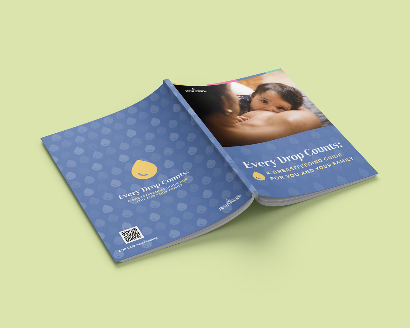 Two copies of the guide fanned open, showing the cover and a photo of a parent breastfeeding, on a green background.