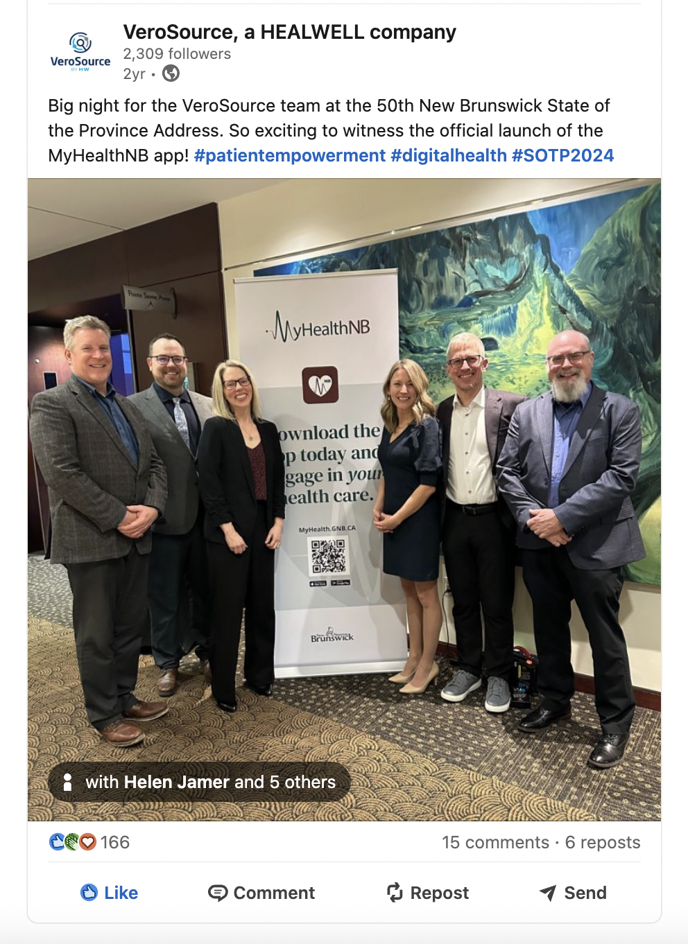 Photo of the VeroSource team at the State of the Province address, posed beside a MyHealthNB banner.